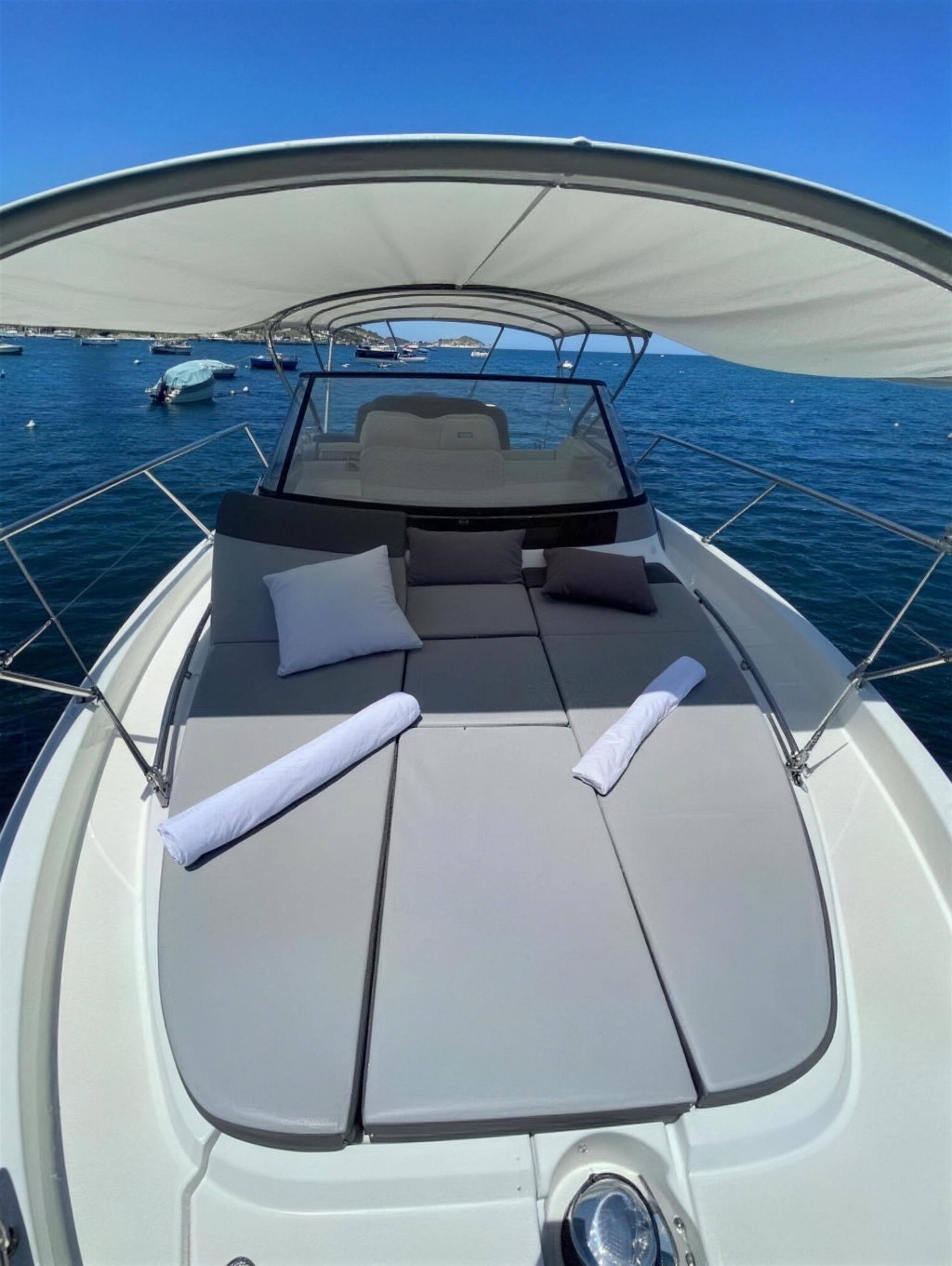 Sunpads on the foredeck, shaded by the canopy