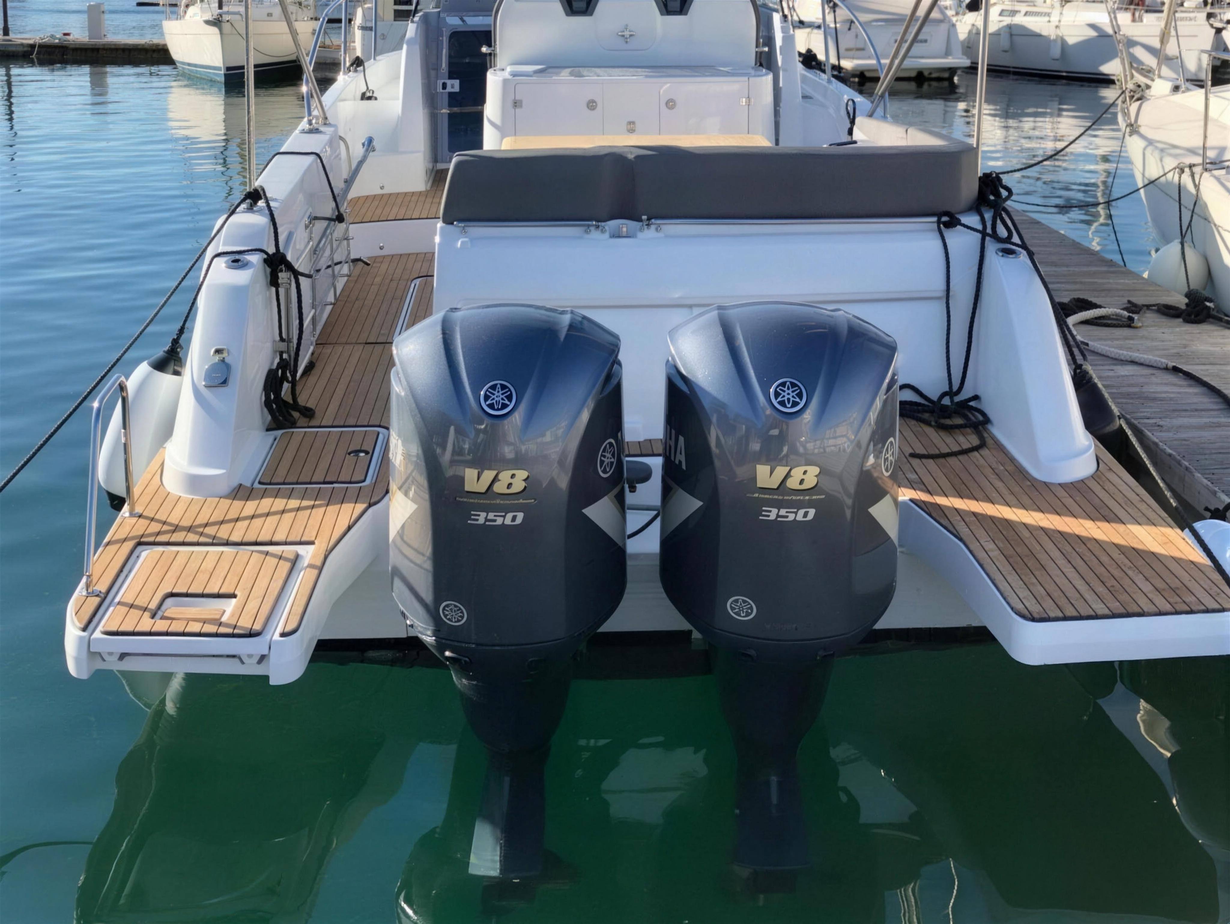 Twin Yamaha V8 350hp outboards on the transom, teak bathing platforms either side